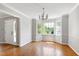 Sunny dining room with hardwood floors, a bay window, and neutral paint at 300 Silvercliff Trl, Cary, NC 27513