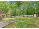 Backyard with a shed and lush green space, perfect for outdoor activities and storage at 300 Wakewood Ct, Raleigh, NC 27615