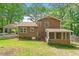Exterior backyard showcasing lush green grass and mature trees, a perfect outdoor space at 300 Wakewood Ct, Raleigh, NC 27615