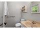 Cozy bathroom features a tiled floor, neutral color palette, and functional fixtures at 300 Wakewood Ct, Raleigh, NC 27615