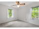 Bright bedroom with neutral walls, carpet, and bright windows at 300 Wakewood Ct, Raleigh, NC 27615