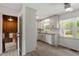 Bright kitchen with white cabinets, granite countertops, and stainless steel appliances at 300 Wakewood Ct, Raleigh, NC 27615