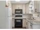 Modern kitchen with stainless steel appliances and granite countertops at 300 Wakewood Ct, Raleigh, NC 27615