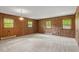 Spacious living room features carpet and hardwood walls at 300 Wakewood Ct, Raleigh, NC 27615