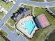 Overhead shot of the pool, basketball court and clubhouse in a well-manicured community at 3032 Curling Creek Dr, Apex, NC 27502