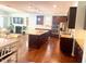 Spacious kitchen with granite countertops, stainless steel appliances, and hardwood floors at 3032 Curling Creek Dr, Apex, NC 27502