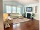Inviting living room with a fireplace, large windows, and comfortable seating area at 3032 Curling Creek Dr, Apex, NC 27502