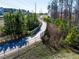 Scenic view of a community walking path with a wooden bridge and lush greenery at 3032 Curling Creek Dr, Apex, NC 27502