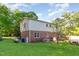 Spacious backyard featuring a lush green lawn, mature trees, and well-maintained landscaping at 3209 Marie Dr, Raleigh, NC 27604
