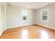 Spacious bedroom with natural light, wood floors and two windows with views at 3209 Marie Dr, Raleigh, NC 27604