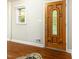 The front entryway features hardwood floors and a stained glass door with adjacent window at 3209 Marie Dr, Raleigh, NC 27604