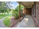 View of the home's covered brick porch and landscaping at 3209 Marie Dr, Raleigh, NC 27604