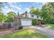 View of the home's two-car garage, siding, brick exterior, landscaping, and long driveway at 3209 Marie Dr, Raleigh, NC 27604