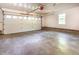 Spacious garage featuring an automatic door, ample space for storage, and concrete flooring at 3209 Marie Dr, Raleigh, NC 27604