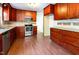 Kitchen featuring wood cabinets, granite countertops, and stainless-steel appliances at 3209 Marie Dr, Raleigh, NC 27604