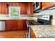 Close up of updated kitchen featuring stainless steel appliances and granite counters at 3209 Marie Dr, Raleigh, NC 27604