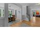 Elegant dining room featuring hardwood floors, soft gray walls, and large windows, perfect for Gathering gatherings at 3425 Donnigale Ave, Durham, NC 27705