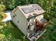 Aerial view of solar panel-equipped home with rear patio and deck at 3425 Donnigale Ave, Durham, NC 27705