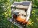 Aerial view of home with solar panels, back deck, and patio with firepit at 3425 Donnigale Ave, Durham, NC 27705