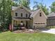 Inviting two-story home with a manicured lawn, covered porch, and two-car garage, showcasing traditional charm at 3425 Donnigale Ave, Durham, NC 27705