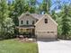 Beautiful two-story home with a welcoming front porch, attached two-car garage, and well-maintained landscaping at 3425 Donnigale Ave, Durham, NC 27705