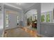 Welcoming foyer with hardwood floors, an arched doorway, and ample natural light, creating a bright and airy entrance at 3425 Donnigale Ave, Durham, NC 27705