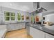 Spacious kitchen with stainless steel appliances, gray countertops, and a view into the living room at 3425 Donnigale Ave, Durham, NC 27705