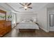 Bright and airy main bedroom featuring tray ceiling, wood floors, and neutral decor at 3425 Donnigale Ave, Durham, NC 27705