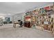 Office with built-in bookshelves, large desk, and sitting area overlooking backyard at 3425 Donnigale Ave, Durham, NC 27705