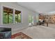 Spacious office with built-in bookshelves, large windows overlooking backyard and an exterior door at 3425 Donnigale Ave, Durham, NC 27705