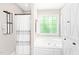 Bathroom featuring a jacuzzi tub and a shower with a decorative curtain at 3436 Candlebrook Ct, Mebane, NC 27302