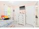 Cozy bedroom with a chandelier and a dresser with a TV at 3436 Candlebrook Ct, Mebane, NC 27302