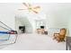 Large bonus room with multiple desks, chair, ceiling fan, and great natural light perfect for a game room at 3436 Candlebrook Ct, Mebane, NC 27302