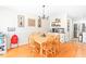 Bright dining room with hardwood floors and a wooden table at 3436 Candlebrook Ct, Mebane, NC 27302