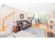 Bright living room featuring hardwood floors, a ceiling fan, and an open layout at 3436 Candlebrook Ct, Mebane, NC 27302