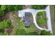 A private home on a treed lot with a circular drive and professional landscaping at 35 Fire Tower Dr, Rougemont, NC 27572