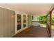 Back porch has welcoming doors with outdoor ceiling lights and a mat at 35 Fire Tower Dr, Rougemont, NC 27572