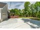 An incredible backyard deck to enjoy the scenery, the home features ample parking space on its gravel driveway at 35 Fire Tower Dr, Rougemont, NC 27572