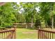 Backyard view of the greenery and lake from the back porch at 35 Fire Tower Dr, Rougemont, NC 27572