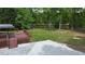 Expansive backyard with deck, gravel and lake access for outdoor enjoyment at 35 Fire Tower Dr, Rougemont, NC 27572