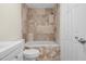 Bathroom featuring tiled shower and tub combo, toilet, vanity, and tile flooring at 35 Fire Tower Dr, Rougemont, NC 27572
