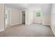 Bedroom featuring neutral carpet, a ceiling fan, and a closet with bi-fold doors at 35 Fire Tower Dr, Rougemont, NC 27572