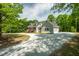 Charming gray home featuring a covered porch and a long driveway at 35 Fire Tower Dr, Rougemont, NC 27572