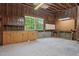 Unfinished garage with storage, workbench, and natural light at 35 Fire Tower Dr, Rougemont, NC 27572