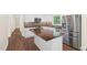 Bright kitchen showcasing white cabinets, stainless steel appliances, unique backsplash, and a stunning wood countertop island at 35 Fire Tower Dr, Rougemont, NC 27572