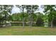 Scenic lake view framed by trees with a gazebo/dock on the water's edge at 35 Fire Tower Dr, Rougemont, NC 27572