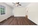 Bright living room with hardwood floors, a ceiling fan, and natural light from the front door at 35 Fire Tower Dr, Rougemont, NC 27572