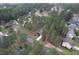 Aerial view of a neighborhood with tree-lined streets and well-maintained homes at 35 Pine Water Way, Spring Lake, NC 28390
