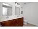 A bathroom with double sinks, granite counters, tile floors, and chrome fixtures at 35 Pine Water Way, Spring Lake, NC 28390