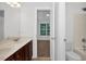 Bathroom featuring double sinks, white countertops, and shower/tub combo at 35 Pine Water Way, Spring Lake, NC 28390